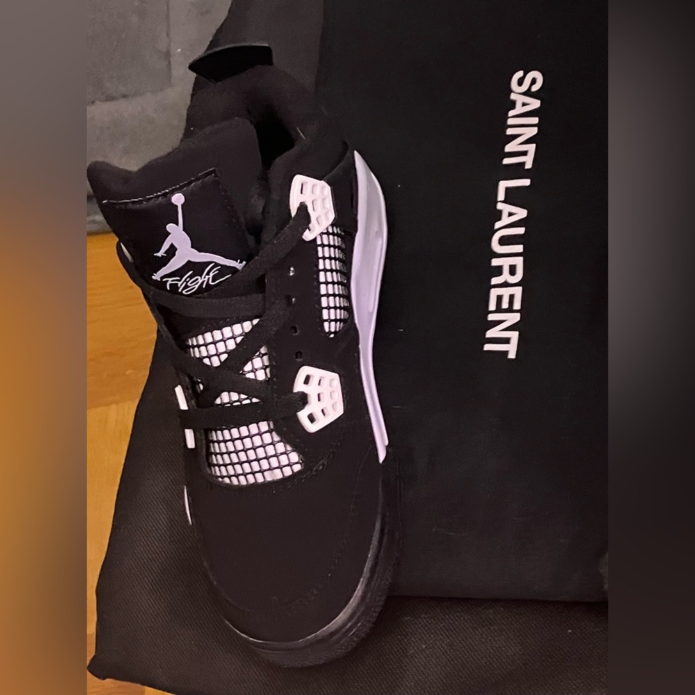 Women’s “White Thunder”  Air Jordan 4’s